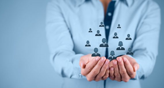 Customer or employees care concept Customer care, care for employees, labor union, CRM, and life insurance concepts. Protecting gesture of businesswoman or personnel with icons representing group of people.